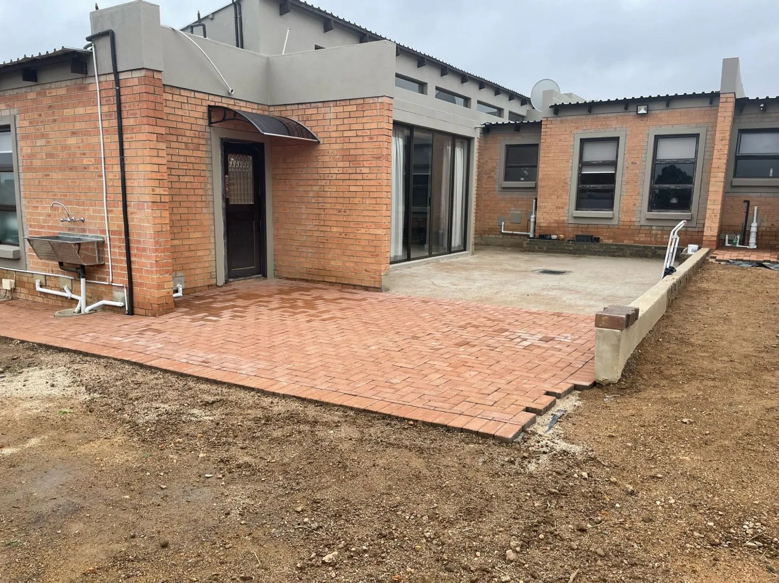 Completed exterior with brick paving