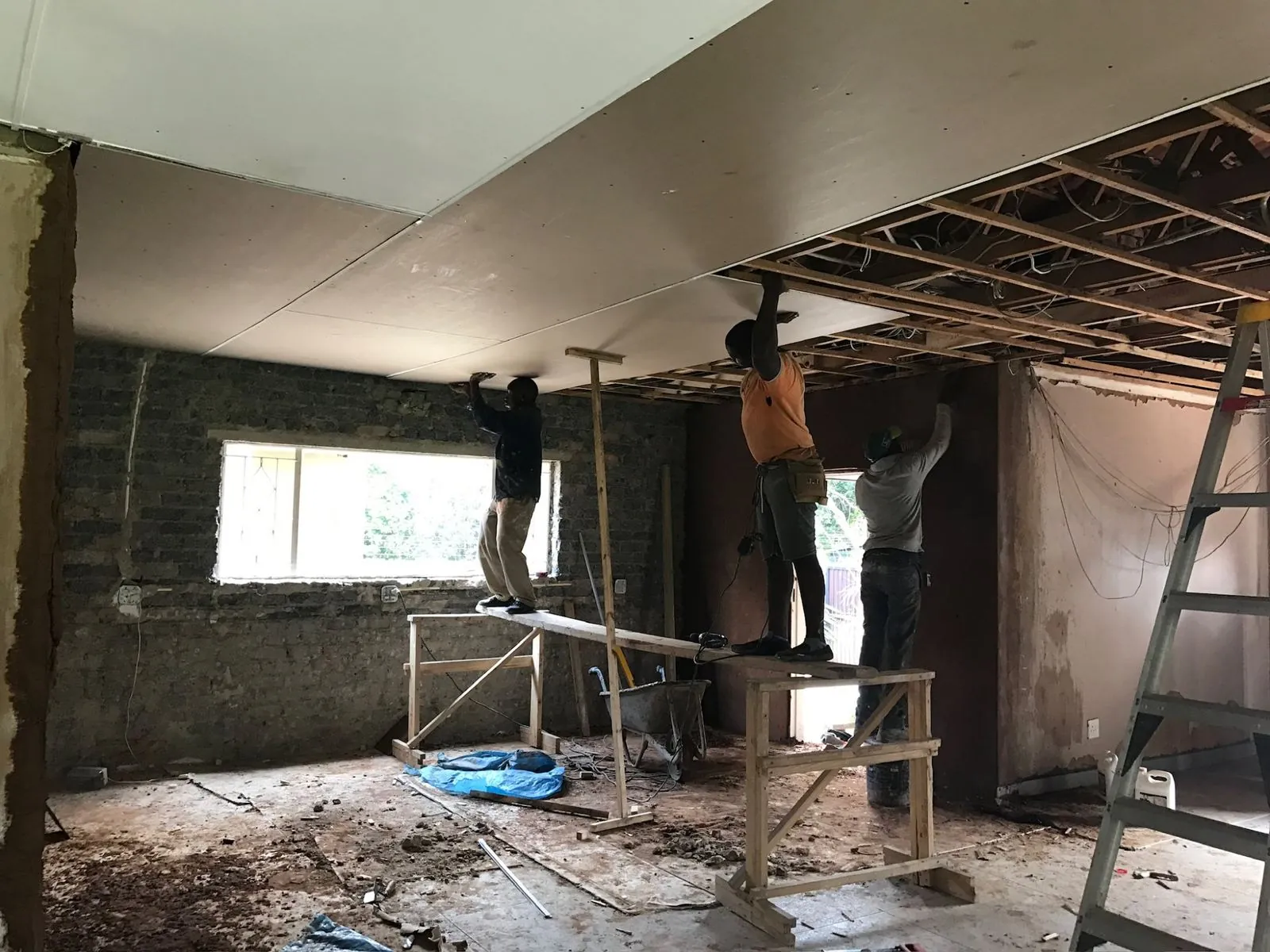 Ceiling boards being fitted